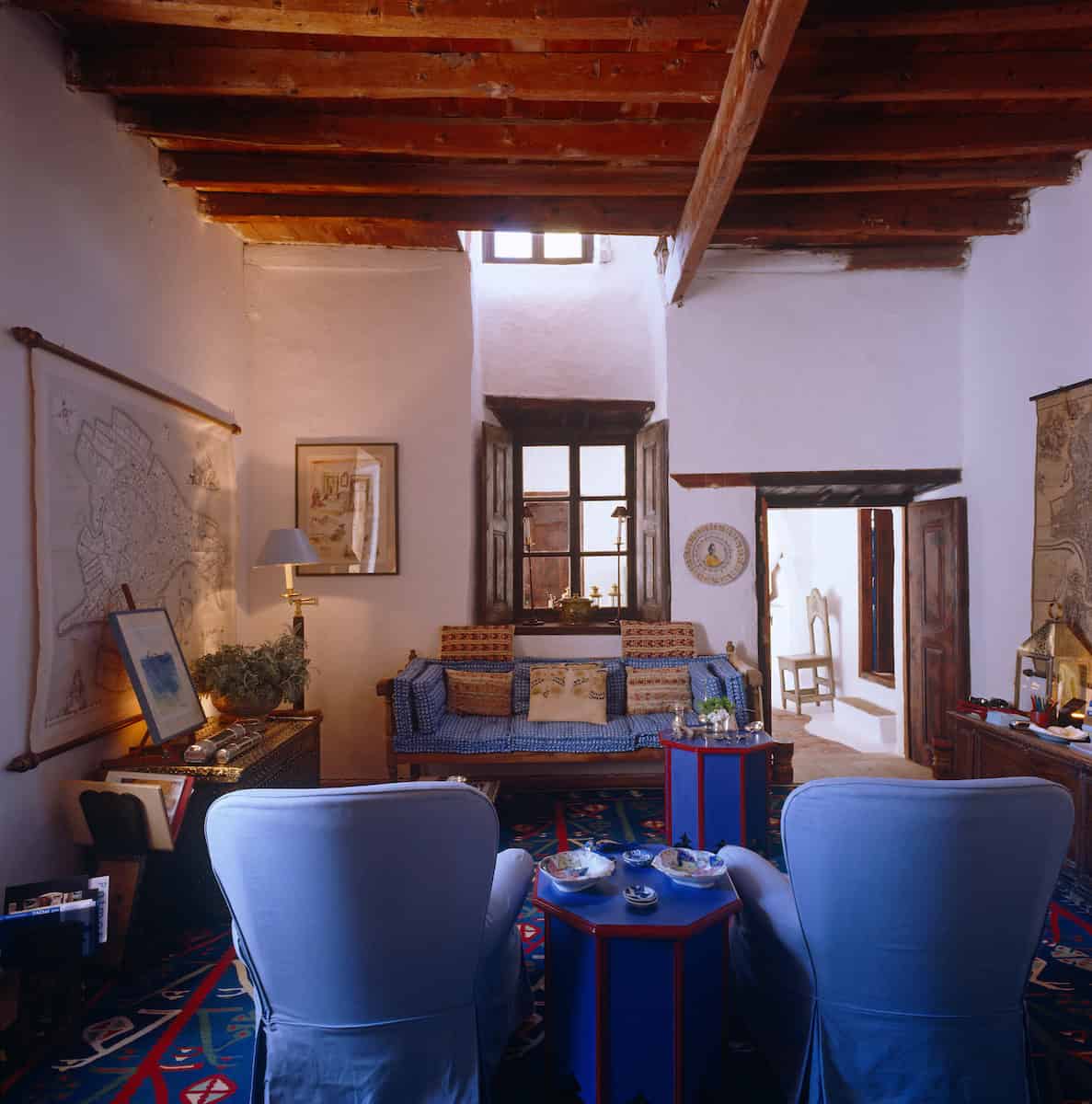 John Stefanidis' blue living room in Patmos is accessorised with an eclectic mixture of objects.