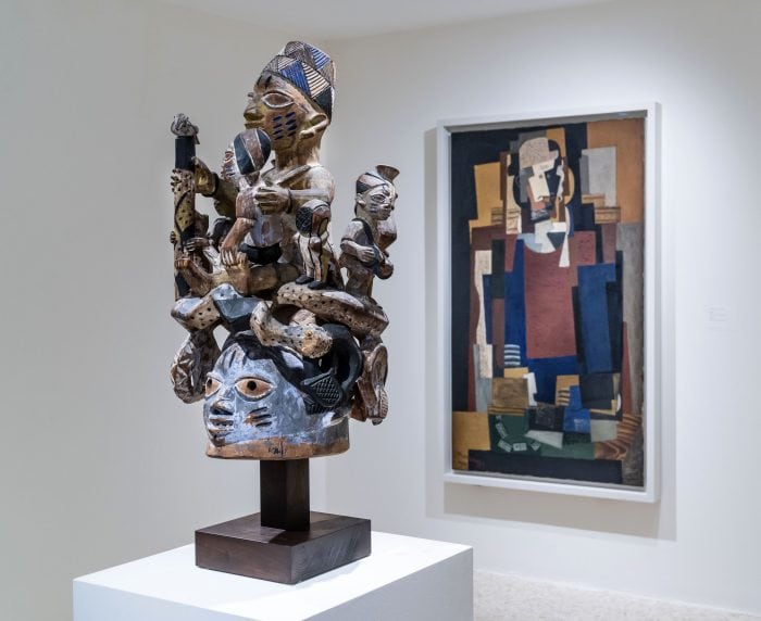 L’Habitué (The Regular) by Louis Marcoussis and a Yoruba Ago Egungun headdress, Peggy Guggenheim Collection.