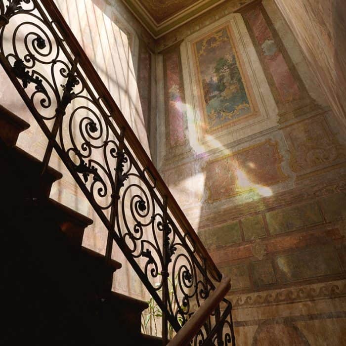 Original Belle Époque murals in the staircase entrance of Tbilisi boutique hotel, Unfound Door.