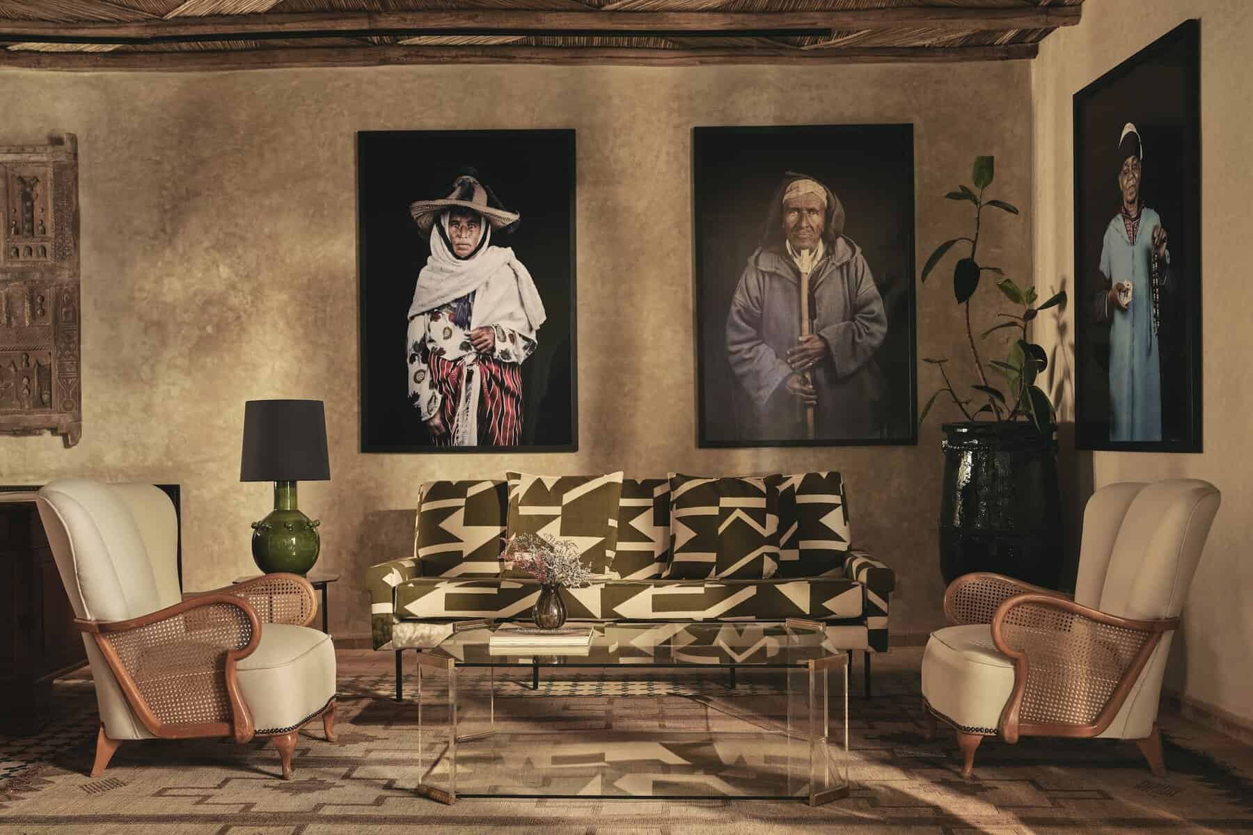 Midcentury furniture and striking works by photographer Leila Alaoui in the reception of IZZA Marrakech.