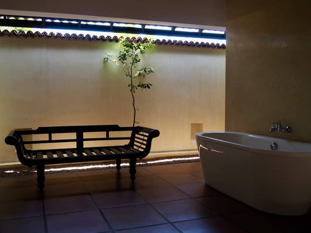Geoffrey Bawa's indoor-outdoor bathroom at Jetwing Lagoon Wellness.