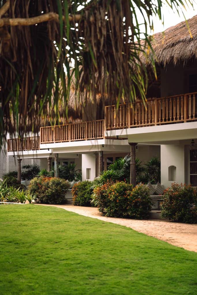 Thatched bungalows at Halcyon Mawella boutique hotel, Sri Lanka.