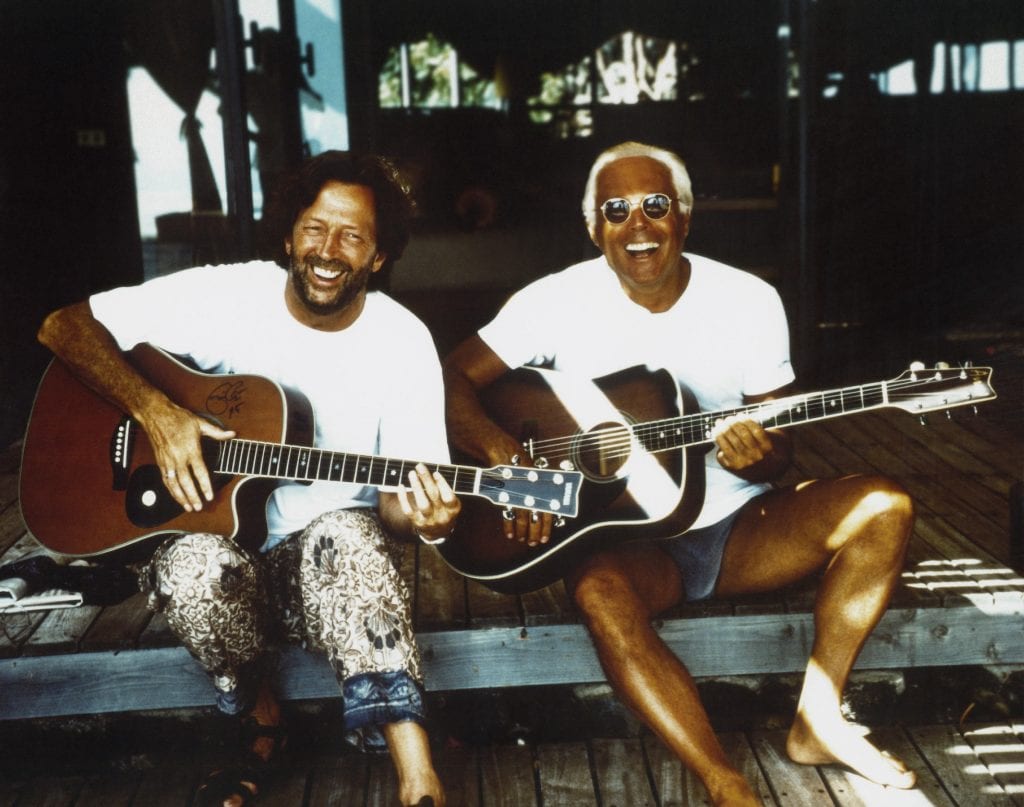 Giorgio Armani plays guitar with Eric Clapton in 1996.