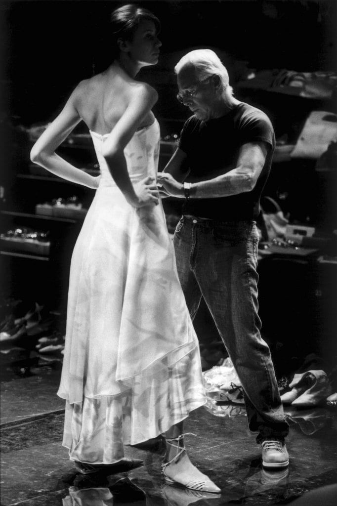 Giorgio Armani dresses model Gina Di Bernardo backstage.