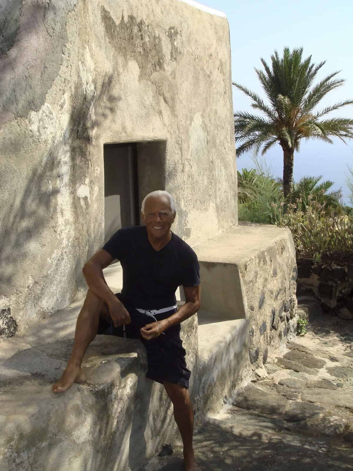 Giorgio Armani by one of the dammuso at his home on the island of Pantelleria.