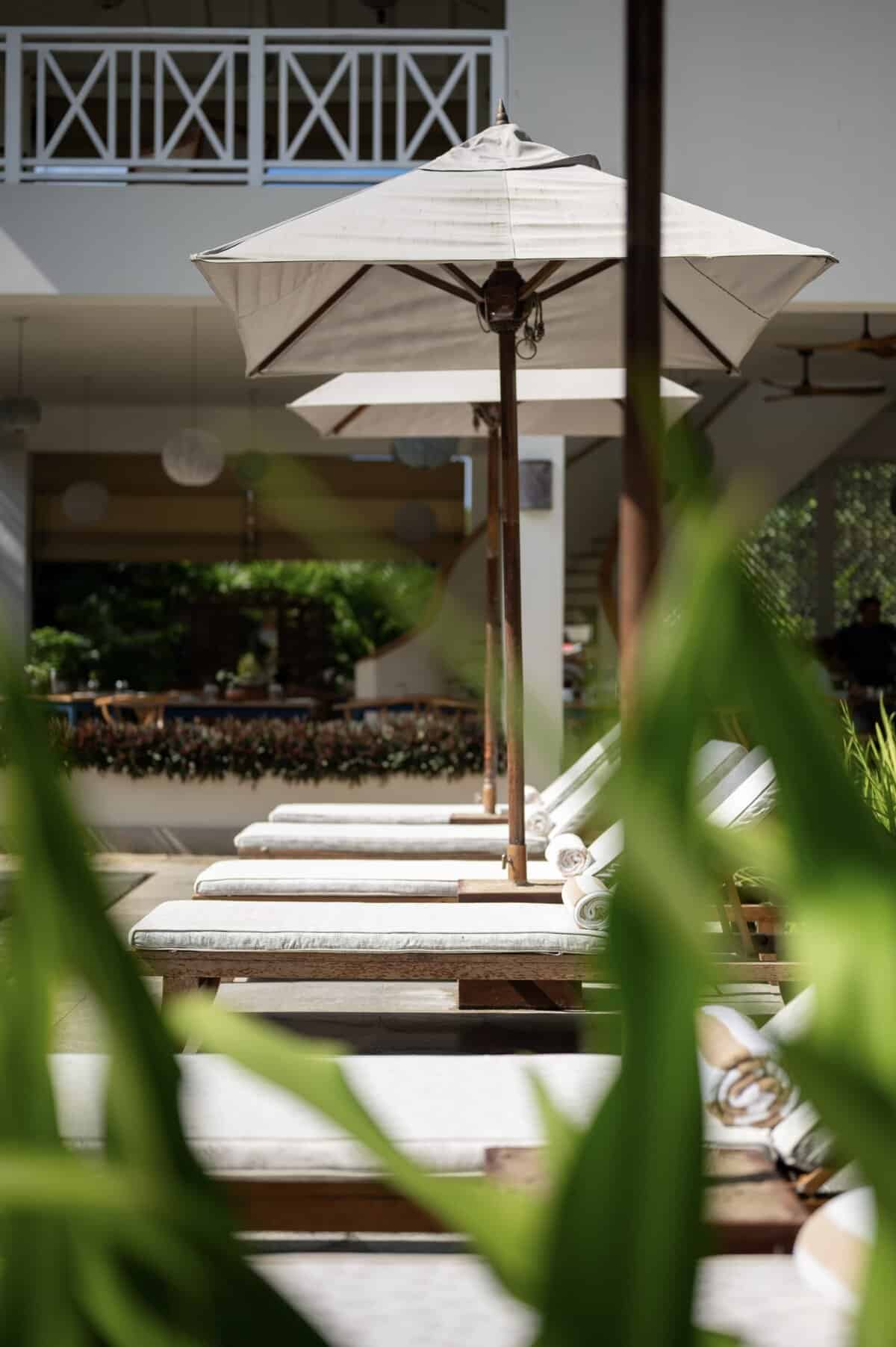Sun loungers by the swimming pool, Halcyon Mawella boutique hotel, Sri Lanka.