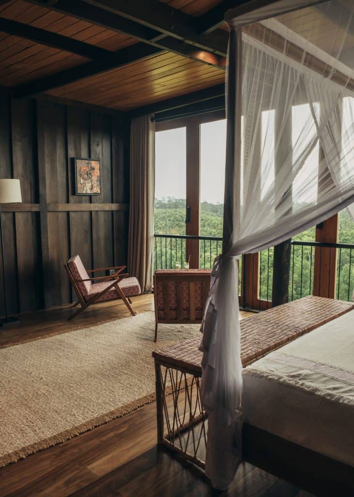 Kumbuk guest room features a king four-poster bed, Trebartha East:The Roundhouse, Sri Lanka.