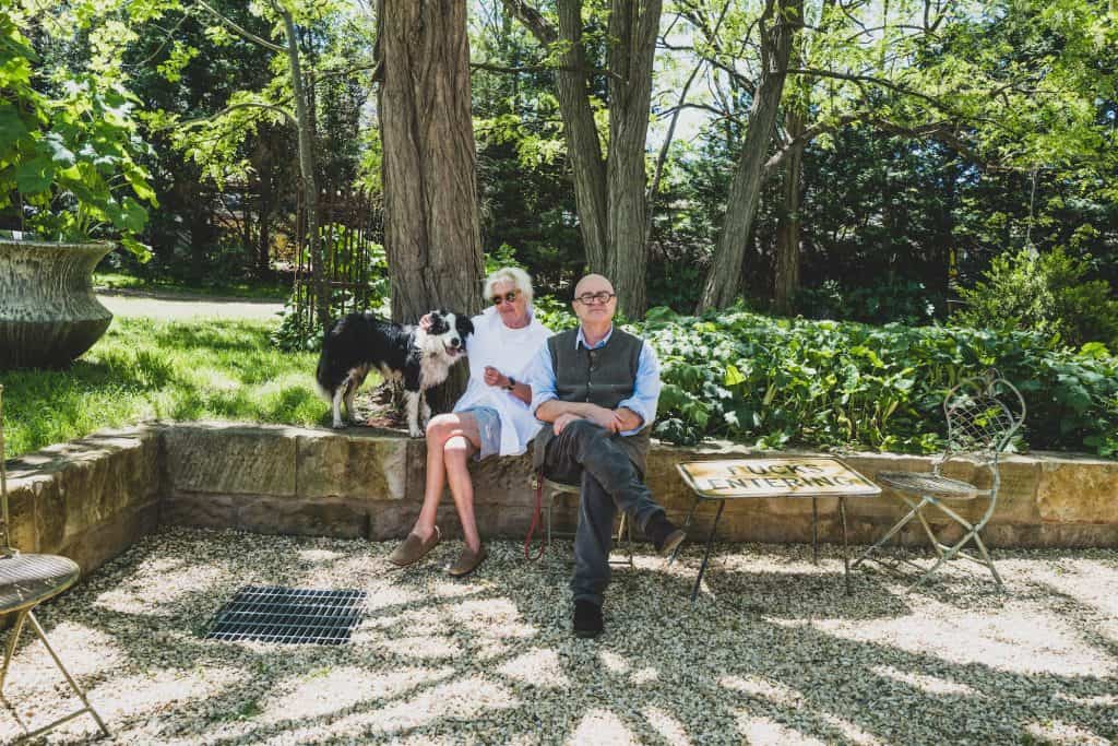 Michael Reid and his wife, Nellie Dawes in their Murrurundi garden with border collie Bunty.