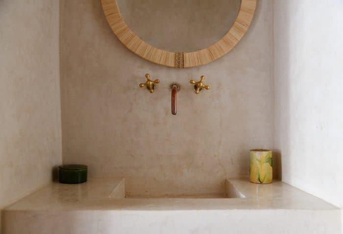 Tadelaxt bathroom with copper taps and cane mirror, Riad UP, Marrakech.