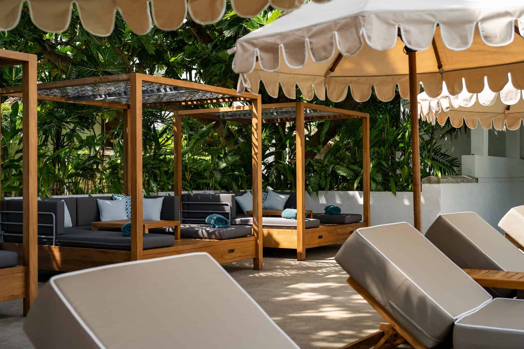 Sun loungers and daybeds by the swimming pool, Fort Bazaar boutique hotel, Galle Fort, Sri Lanka.