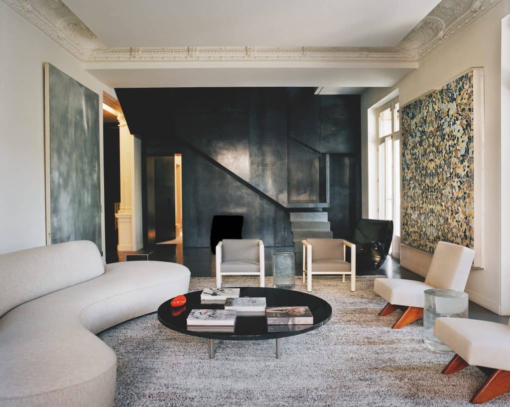 Jacques Grange. Jacques Grange interior with pieces by Eduardo Chillida/Zabalaga-Leku, Ron Arad, Vladimir Kagan, Robert Mallet- Stevens, Pierre Jeanneret, Martin Szekely and Damien Hirst.