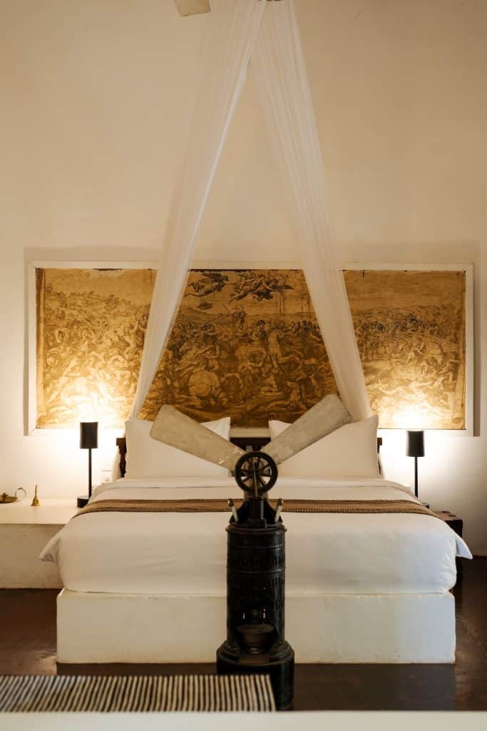 Lunuganga. Main House Studio at Geoffrey Bawa's Lunuganga, with vintage fan and 18th-century European panels above the bed.