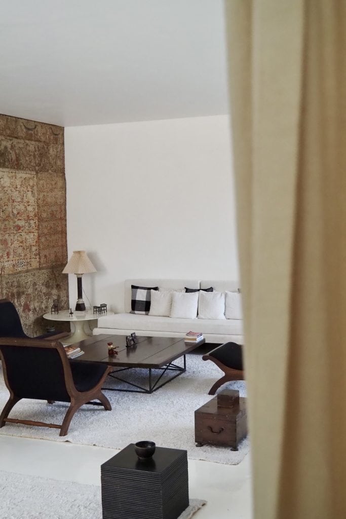Geoffrey Bawa. A wall of batik and antique and modern furniture at No. 11, the colombo home of Geoffrey Bawa.