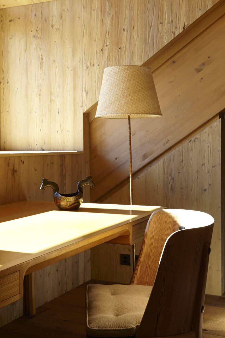 Axel Einar Hjorth. A curved timber chair by Axel Einar Hjorth in an interior designed by Pierre Yovanovitch, Andermatt, Switzerland.