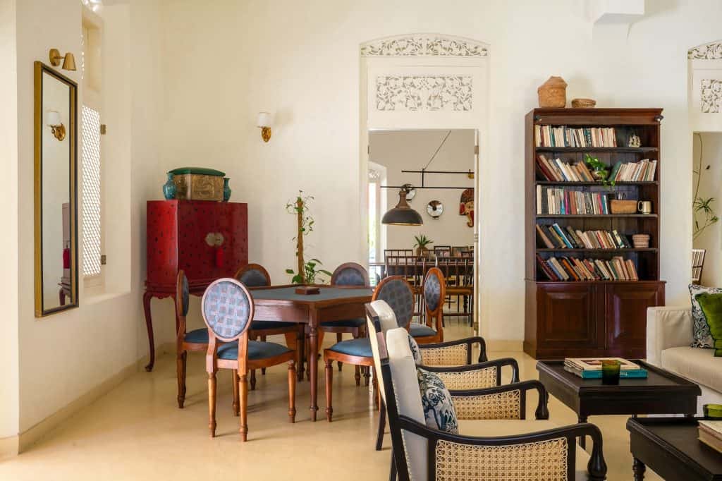 the-sun-house-living-room Living room with card table and red lacquer cabinet, The Sun House hotel Galle.